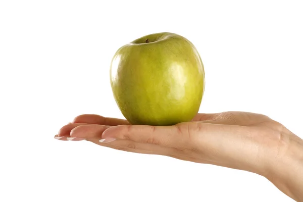 Green apple in a female beautiful hand — Stock Photo, Image
