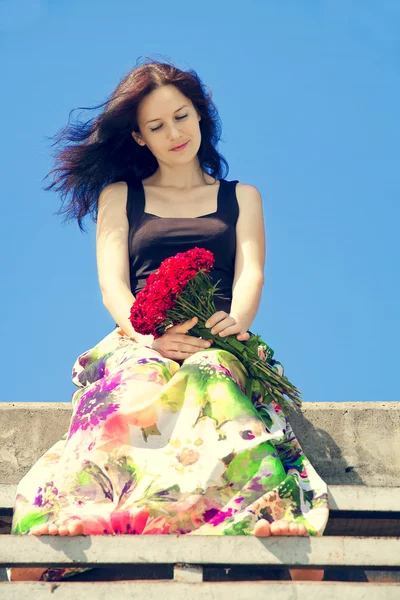 Beautiful girl with flowers — Stock Photo, Image