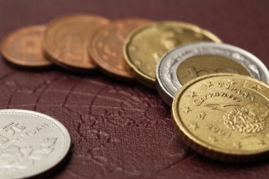 Coins of various countries on the world map