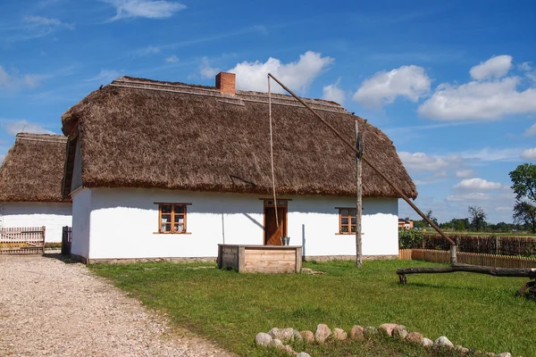 Old rural wooden white house, open-air museum, Poland — Stock Photo, Image