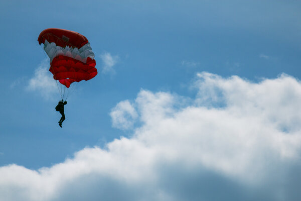 Parachutist in the sky