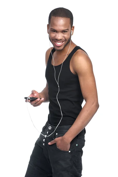 Smiling man listening to mp3 player — Stock Photo, Image