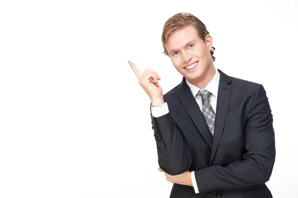 Joven hombre de negocios guapo señalando dedo hacia arriba — Foto de Stock