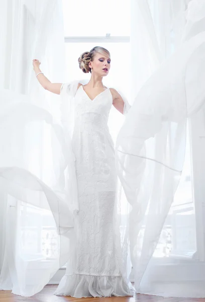 Beautiful Bride Standing By Open Window — Stock Photo, Image