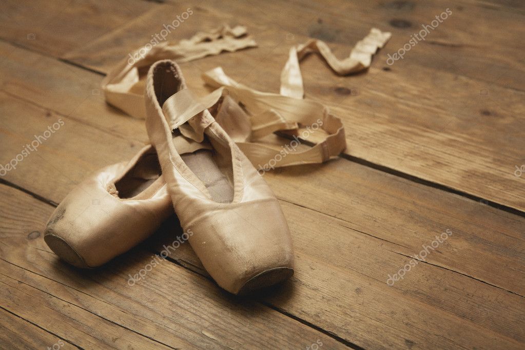 Ballet Shoes on Wooden Floor — Stock Photo © mimagephotos #21801455