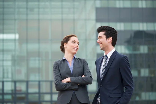Portrait of a happy businessman and business woman smiling — Stock Photo, Image