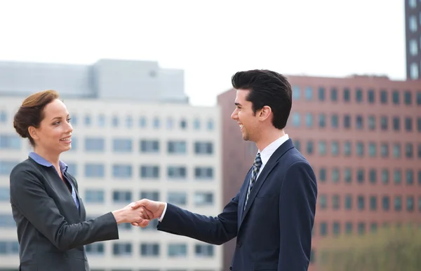 Businessman and business woman handshake greeting — Stock Photo, Image