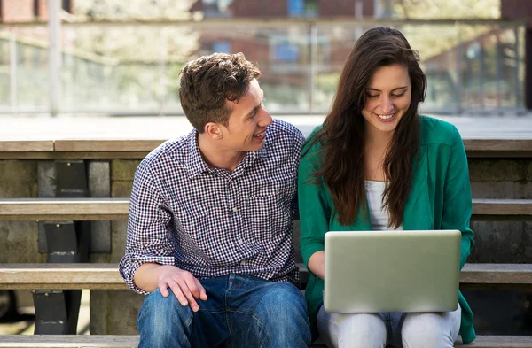 University students working on laptop outdoors — Stock Photo, Image