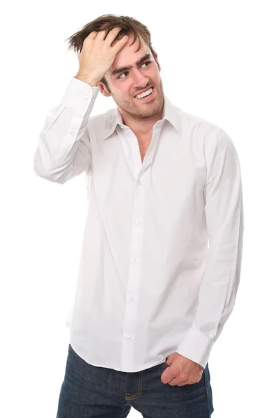 Bonito jovem sorrindo com a mão no cabelo — Fotografia de Stock