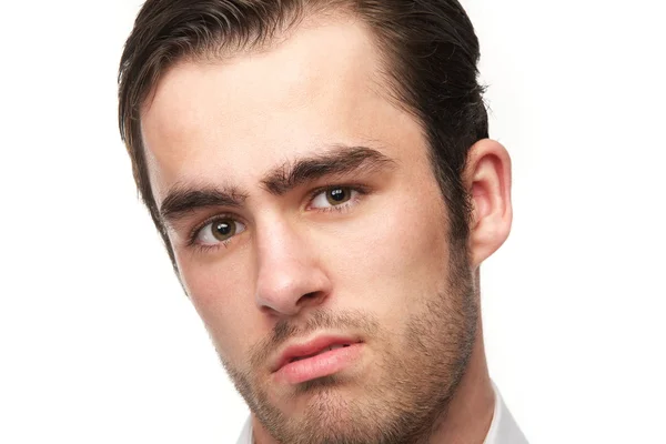 Retrato de un joven guapo aislado en blanco — Foto de Stock