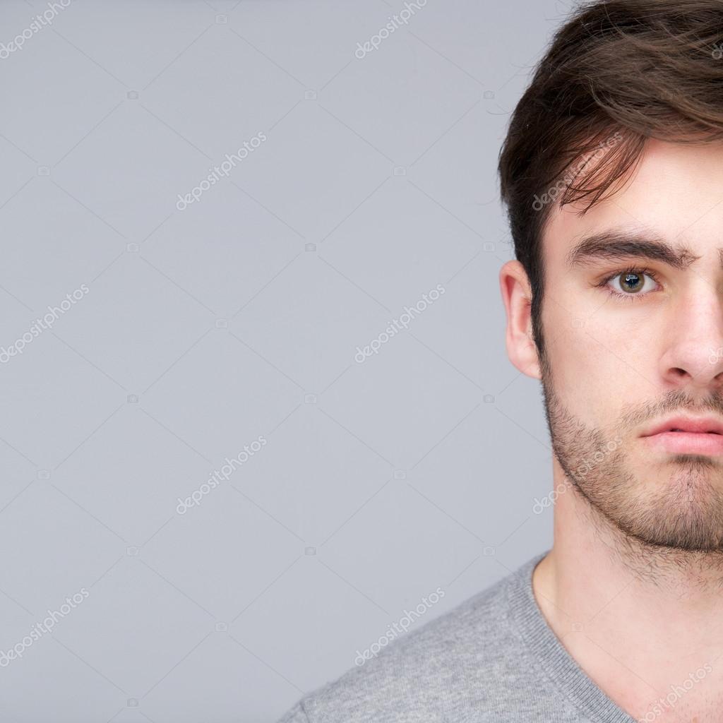 Half face portrait of a handsome young man — Stock Photo © mimagephotos