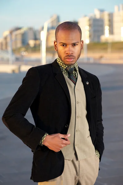 Portrait of a trendy young man standing outdoors — Stock Photo, Image