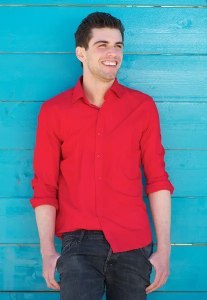 Happy young man standing outdoors — Stock Photo, Image