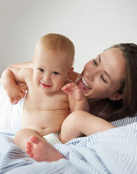 Baby and mother playing Stock Image