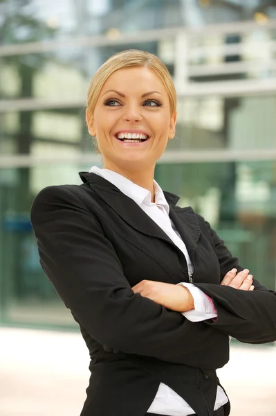 Happy businesswoman smiling in the city Royalty Free Stock Photos