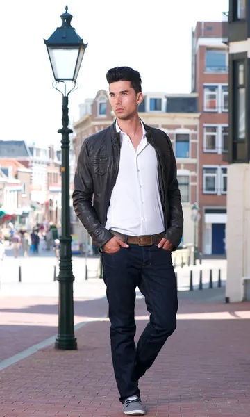 Handsome young man walking outdoors — Stock Photo, Image