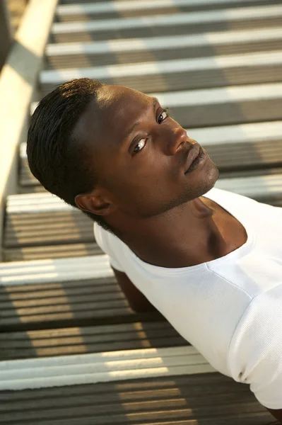 Portrait of a handsome young man relaxing outside — Stock Photo, Image