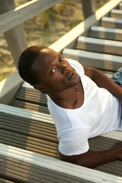 Portrait of a casual young man relaxing outdoors — Stock Photo, Image