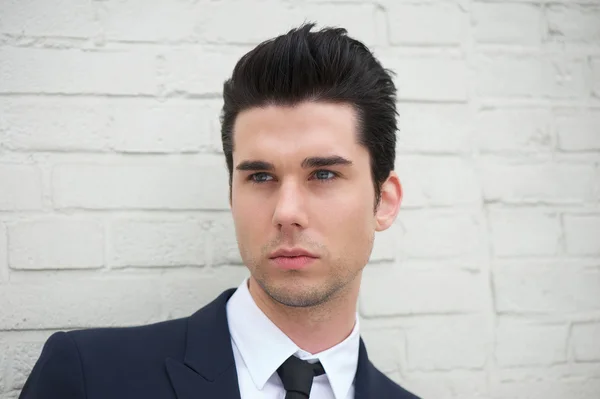 Portrait of a handsome young man in business suit — Stock Photo, Image