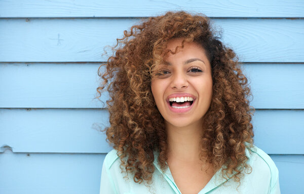 Cheerful young african woman smiling Stock Photo
