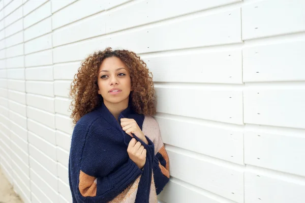 Portrait of an attractive young woman posing outdoors with sweater — Stock Photo, Image