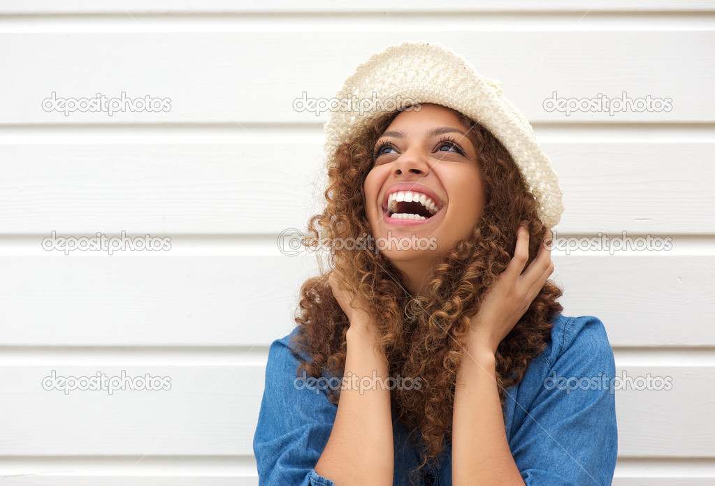 Portrait of a happy female fashion model laughing