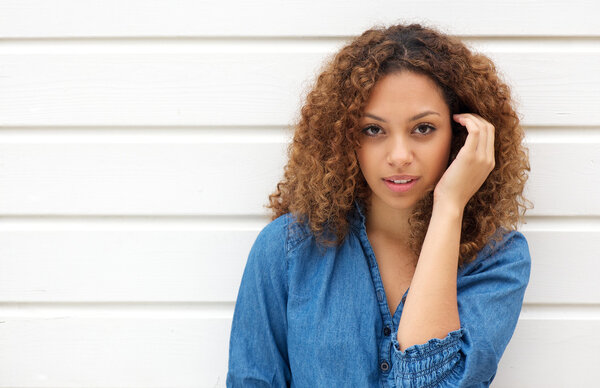 Attractive female looking at camera with hand in hair