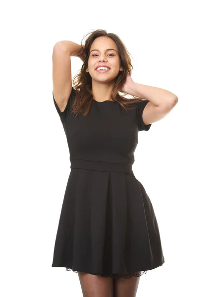 Cheerful young woman laughing with hands in hair — Stock Photo, Image