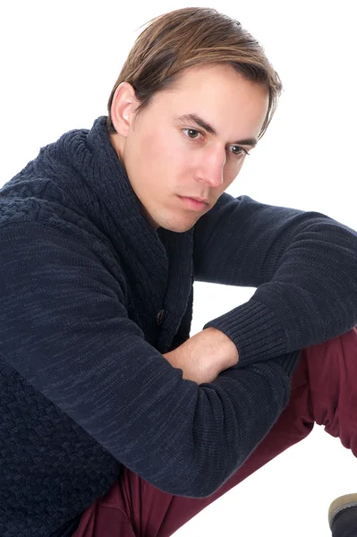 Close up portrait of a young man sitting alone — Stock Photo, Image