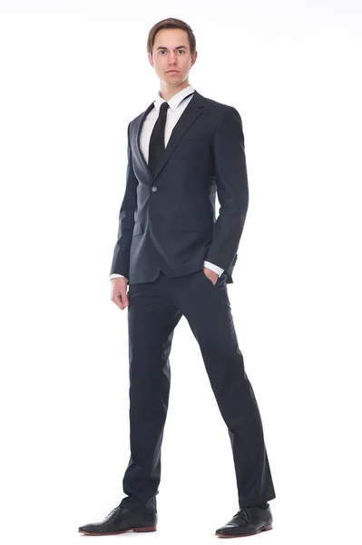 Full body portrait of a handsome young businessman in black suit — Stock Photo, Image