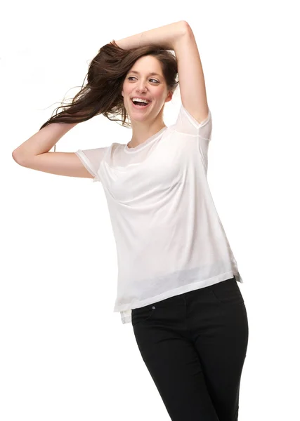 Carefree woman laughing with hand in hair — Stock Photo, Image