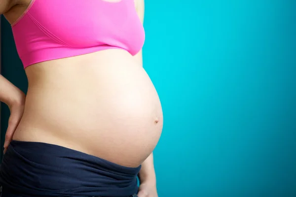 Close up pregnant female stomach — Stock Photo, Image