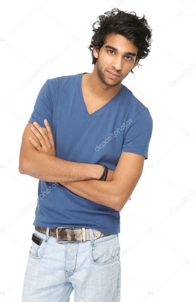 Casual young man standing with arms crossed