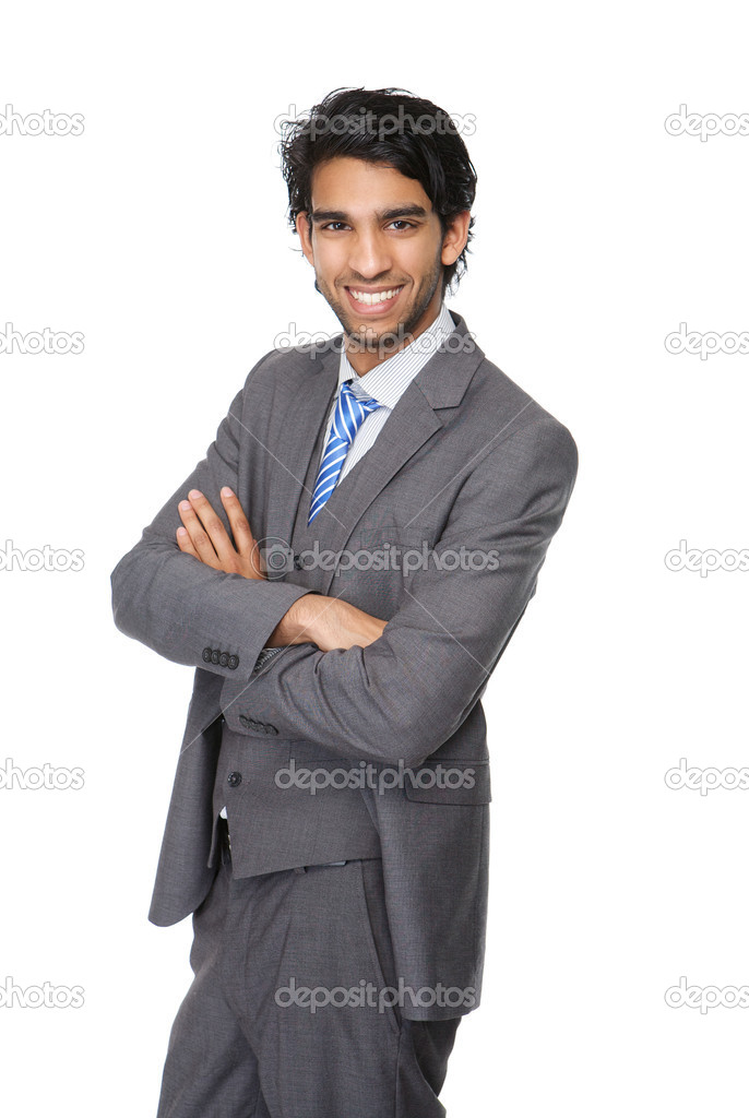 Young businessman smiling with arms crossed