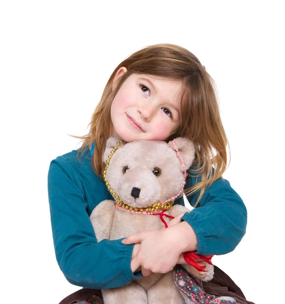Menina bonito abraçando ursinho de pelúcia — Fotografia de Stock