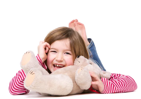 Junges Mädchen mit Teddybär lachen — Stockfoto