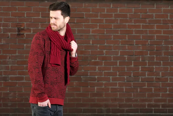 Young man with scarf outdoors