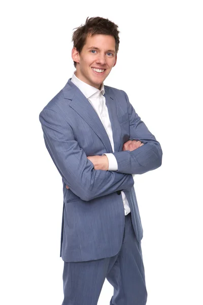 Hombre de negocios sonriente posando con los brazos cruzados —  Fotos de Stock