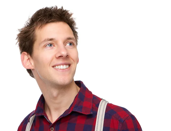 Joven sonriendo y mirando hacia arriba — Foto de Stock