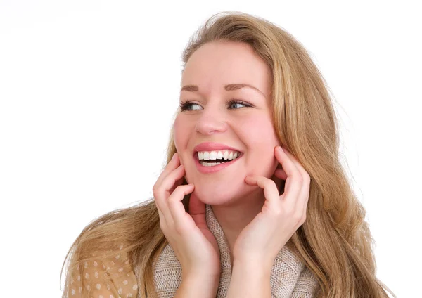 Mujer joven riendo con las manos a la cara sobre fondo blanco aislado — Foto de Stock