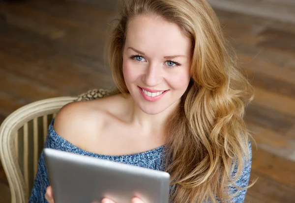 Young woman relaxing with touchscreen tablet Royalty Free Stock Photos