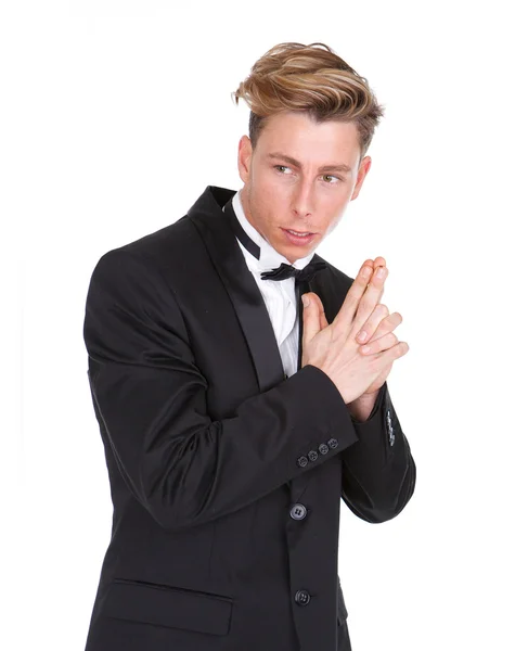 Man in black tuxedo with gun hand gesture — Stock Photo, Image