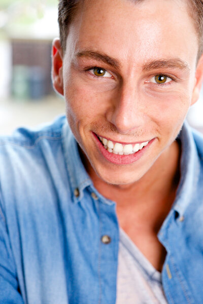 Happy young man smiling