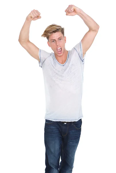 Young man celebrating with arms raised — Stock Photo, Image