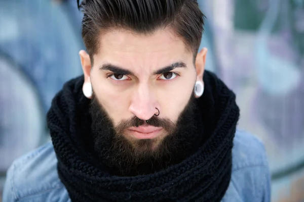 Handsome young man with beard and piercing — Stock Photo, Image