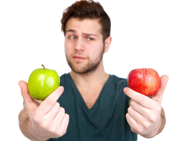 Young man with two apples