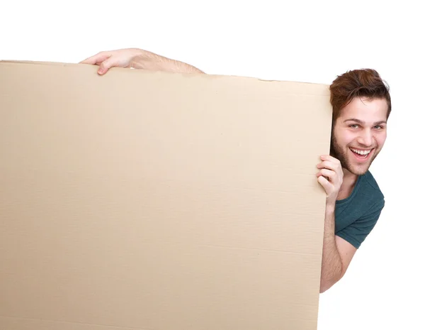 Man smiling and holding empty poster — Stock Photo, Image