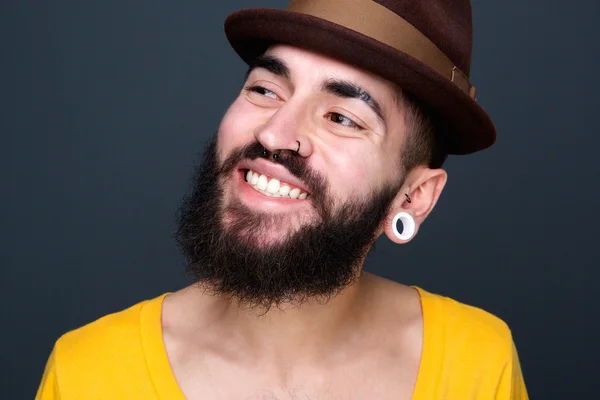 Confident young man with beard smiling — Stock Photo, Image