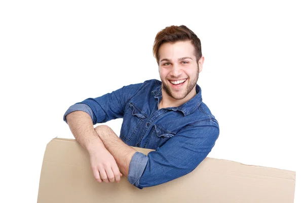 Man leaning on cardboard sign — Stock Photo, Image