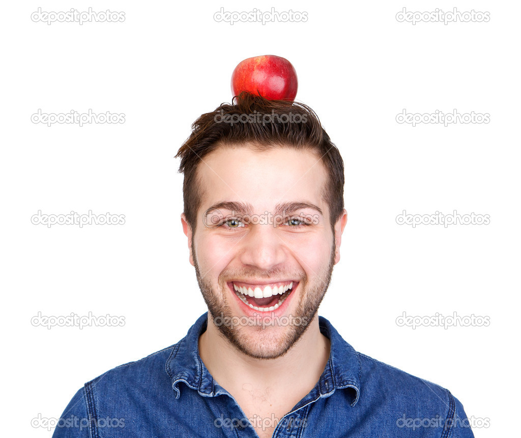 Smiling man balancing apple on head 